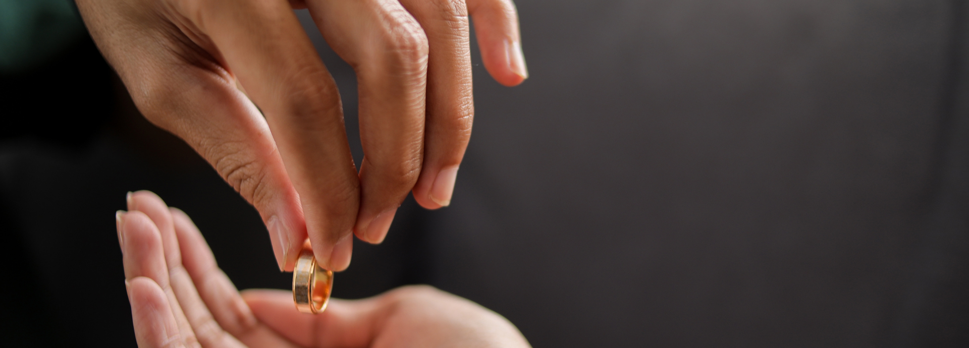 husband giving the wife his wedding ring back